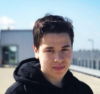Zakaria El Ghoul Aadi, a passionate game developer, posing in a parking lot!